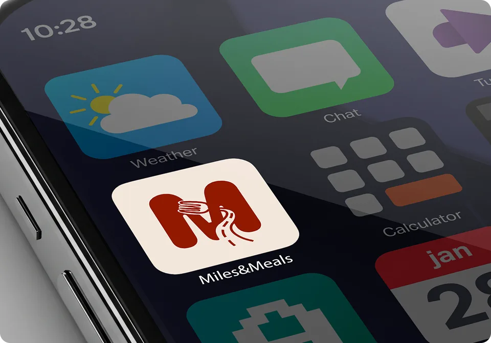Miles&Meals app icon on a phone